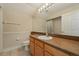 Bathroom featuring vanity, shower and tub with tile surround and neutral tile flooring at 9548 Crown Prince Ln, Windermere, FL 34786