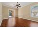 Sunlit bedroom with hardwood floors and backyard access at 9548 Crown Prince Ln, Windermere, FL 34786