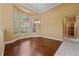 Spacious dining room with wood floors, bay window, and decorative chandelier at 9548 Crown Prince Ln, Windermere, FL 34786