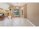 Dining room with tile flooring and access to the outdoor pool at 9548 Crown Prince Ln, Windermere, FL 34786