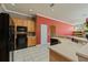 Kitchen with stainless steel appliances and light wood cabinets at 9548 Crown Prince Ln, Windermere, FL 34786