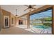 Screened patio overlooking the pool with ceiling fans for a cool breeze at 9548 Crown Prince Ln, Windermere, FL 34786