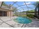 Inviting screened pool with in ground jacuzzi and stainless steel handrail at 9548 Crown Prince Ln, Windermere, FL 34786