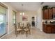 Cozy dining area with tiled floor and decorative lighting at 11800 Buttonhook Dr, Clermont, FL 34711