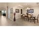 Formal dining room features natural light, a chandelier, and seating for six at 11800 Buttonhook Dr, Clermont, FL 34711