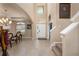 Bright foyer boasts soaring ceilings, neutral paint, and elegant tile flooring, leading to the main living areas at 11800 Buttonhook Dr, Clermont, FL 34711