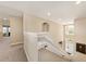 View of the foyer featuring carpeted stairs, high ceilings, and natural light at 11800 Buttonhook Dr, Clermont, FL 34711