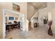 Home office with french doors, desk and stairway, perfect for working at home at 11800 Buttonhook Dr, Clermont, FL 34711