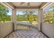 Balcony view overlooking community amenities with screened enclosure and patterned outdoor rug at 1185 Cypress Loft Pl, Lake Mary, FL 32746