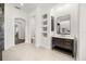 Stylish bathroom with a contemporary vanity, marble countertop, rectangular mirror, and open shelving at 1185 Cypress Loft Pl, Lake Mary, FL 32746