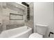 Nicely tiled bathtub and shower with modern showerhead and integrated shelves at 1185 Cypress Loft Pl, Lake Mary, FL 32746