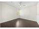 Bright bedroom with wood floors, white walls, and a modern ceiling fan at 1185 Cypress Loft Pl, Lake Mary, FL 32746