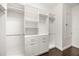 Walk-in closet features custom shelving and ample storage space for clothes and accessories at 1185 Cypress Loft Pl, Lake Mary, FL 32746