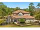 Stately two-story home with a tile roof, manicured landscaping, and a welcoming entrance at 1185 Cypress Loft Pl, Lake Mary, FL 32746