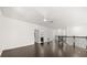 Second floor loft area showcasing dark hardwood floors and elegant black railing at 1185 Cypress Loft Pl, Lake Mary, FL 32746