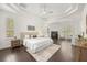 Spacious main bedroom with tray ceiling, fireplace, and ample natural light at 1185 Cypress Loft Pl, Lake Mary, FL 32746