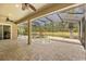 Screened in lanai with a pool that overlooks a large pond surrounded by trees at 1185 Cypress Loft Pl, Lake Mary, FL 32746