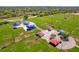 Aerial view of the community playground with covered seating areas, multiple sports fields, and lush greenery at 1259 Freeport Dr, Deltona, FL 32725