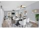 Bright dining room with views to the living room featuring a large dining table and modern seating at 1259 Freeport Dr, Deltona, FL 32725