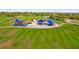 Aerial view of the community playground with covered seating areas and colorful play structures at 1259 Freeport Dr, Deltona, FL 32725