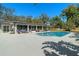 Beautiful backyard features a sparkling pool, comfortable seating areas, and a well-maintained patio at 1285 Seminole Ave, Longwood, FL 32750