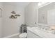 This powder room has a sink, mirror, and wall decorations at 1285 Seminole Ave, Longwood, FL 32750