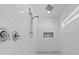 Modern bathroom shower featuring white marble tiles and sleek chrome fixtures at 1285 Seminole Ave, Longwood, FL 32750