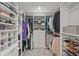 Organized walk-in closet with custom shelving and ample storage space for clothes and accessories at 1285 Seminole Ave, Longwood, FL 32750