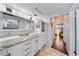 Stylish bathroom boasts a granite countertop double vanity, vessel sinks, and plenty of storage at 1519 N Westmoreland Dr, Orlando, FL 32804