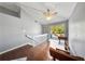Bright living area featuring hardwood floors, vaulted ceilings, and outdoor access to a wood deck at 1519 N Westmoreland Dr, Orlando, FL 32804