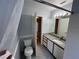 Bathroom showcases granite counters, tiled floors, and ample lighting at 2020 Royal Bay Blvd # 92, Kissimmee, FL 34746