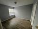Cozy bedroom with hardwood floors, closet, and lots of natural light at 2020 Royal Bay Blvd # 92, Kissimmee, FL 34746