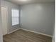 Cozy bedroom with new laminate floors, a large window, and closet at 2020 Royal Bay Blvd # 92, Kissimmee, FL 34746