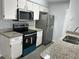 Well-equipped kitchen featuring granite countertops and stainless steel appliances at 2020 Royal Bay Blvd # 92, Kissimmee, FL 34746