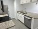 Bright kitchen with granite countertops, stainless appliances, and ample cabinet space at 2020 Royal Bay Blvd # 92, Kissimmee, FL 34746