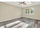 Bright, airy bedroom with modern flooring, neutral walls, and a large window for natural light at 2202 Clubside Dr # 2202, Longwood, FL 32779