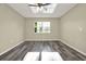 Bedroom featuring wood-look floors, neutral colored walls and a window with natural light at 2202 Clubside Dr # 2202, Longwood, FL 32779