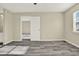 Bedroom featuring modern wood-look flooring with doorway to bathroom and closet space at 2202 Clubside Dr # 2202, Longwood, FL 32779