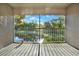 Enjoy the tranquil pond view from the screened-in patio, surrounded by lush greenery at 2202 Clubside Dr # 2202, Longwood, FL 32779