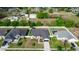 An aerial view of a well-maintained home nestled between neighboring houses with lush green lawns and mature trees at 2258 Ardon Ave, Orlando, FL 32833