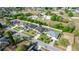 A scenic aerial view of a home in a residential area, with a green field and the community water tower in the background at 2258 Ardon Ave, Orlando, FL 32833