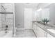 Bright bathroom featuring double sinks, granite countertops, tile floors, and a shower-tub combination at 2258 Ardon Ave, Orlando, FL 32833