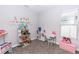 Playroom with large window, ice cream cart, and built-in storage at 2258 Ardon Ave, Orlando, FL 32833