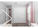 Neutral bedroom featuring a large closet, plush carpet, and a bright window with pink drapes at 2258 Ardon Ave, Orlando, FL 32833