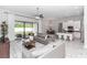 Open-concept living room with tile floors, a ceiling fan, and sliding glass doors to outdoor living space at 2258 Ardon Ave, Orlando, FL 32833