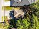 Aerial view of a home with mature landscaping, a driveway, and a well-maintained lawn at 2606 Teeside Ct, Kissimmee, FL 34746