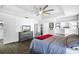 Spacious main bedroom featuring a tray ceiling, ceiling fan, and built-in shelves at 2606 Teeside Ct, Kissimmee, FL 34746