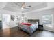 Bright main bedroom with tray ceiling, built-in shelving, and ensuite bathroom at 2606 Teeside Ct, Kissimmee, FL 34746