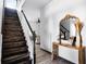 Wooden staircase with white walls, tile floors, and view to the living room at 2606 Teeside Ct, Kissimmee, FL 34746