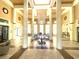 Elegant clubhouse lobby featuring high ceilings, decorative columns, and stylish furnishings at 2612 Robert Trent Jones Dr # 710, Orlando, FL 32835